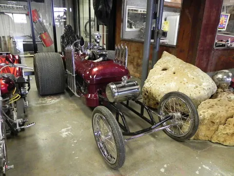 Custom trike beside a boulder